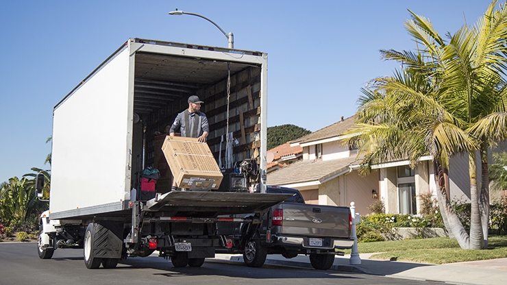 FastTrack delivery truck making a doorstep delivery